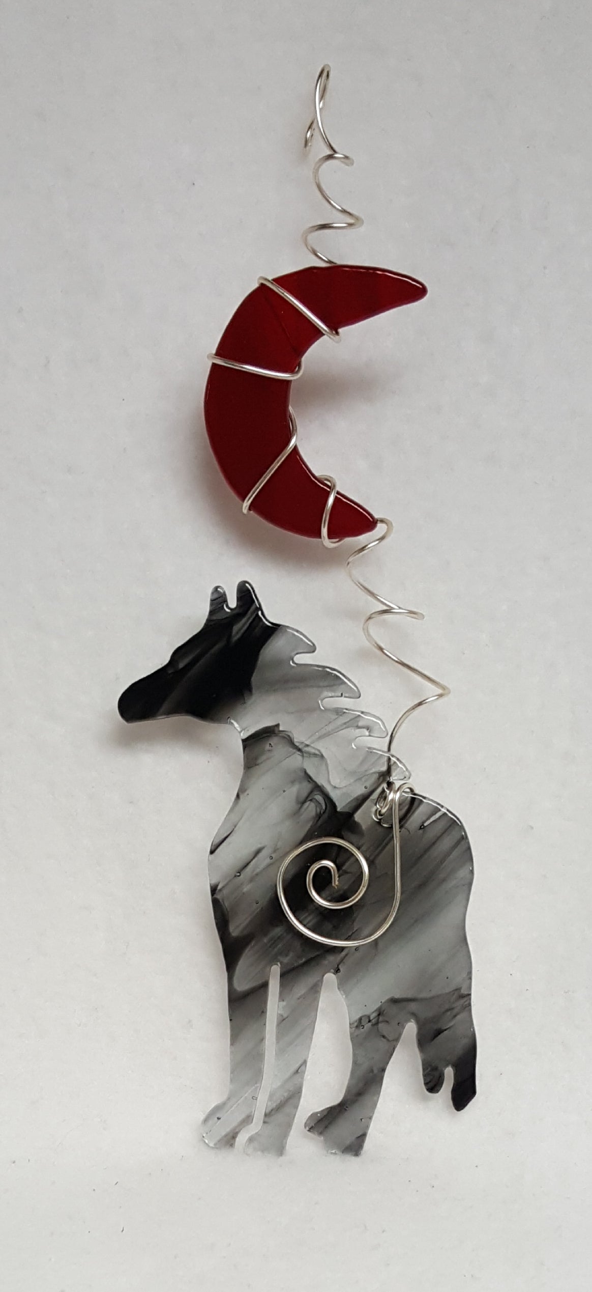 The old grey mare just ain't what she used to be... Now she's a beautiful grey glass horse under a bright red crescent moon. Suncatcher hangs 9.5 inches.