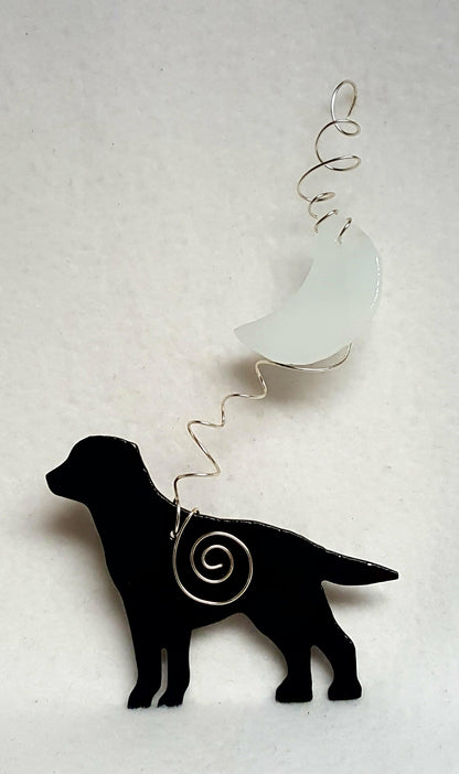 Labrador retrievers are known to be very family friendly and this black one is no exception.  He's standing beneath a misty crescent moon. Suncatcher hangs 8 inches.