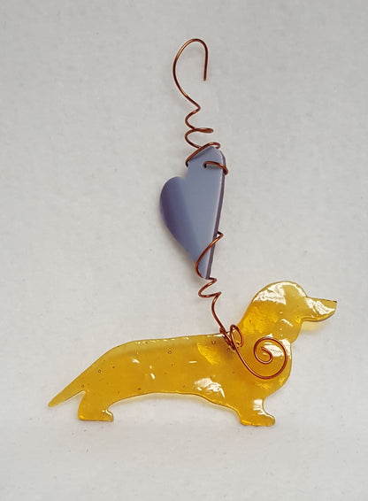 Such a light brown color, this dachshund is almost golden in the light.  A variegated purple heart above him lets him know he's loved. Suncatcher hangs 6 inches.